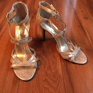 Strappy gold high heeled sandals